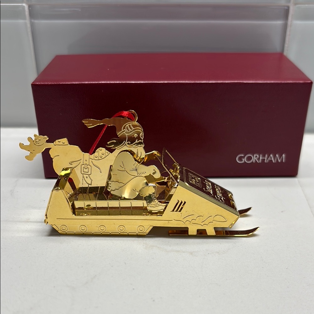 Gorham Gold-tone Santa Snowmobile Ornament with Red Ribbon